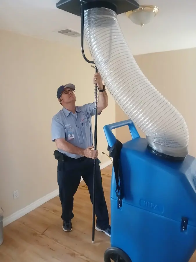 HVAC Installation technician using HEPA equipment in Hutchins